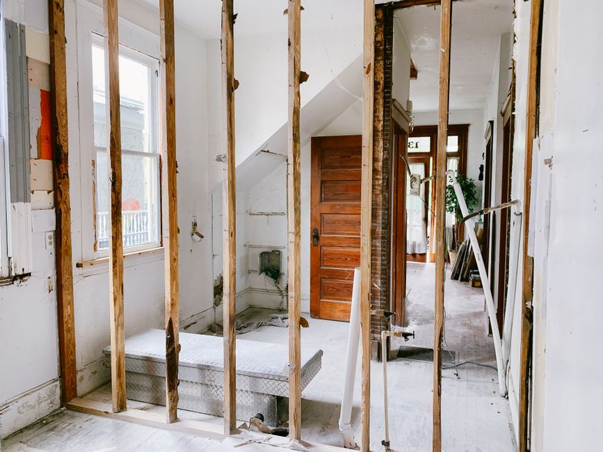 Interior of a home under renovation showing framing and structural work in progress